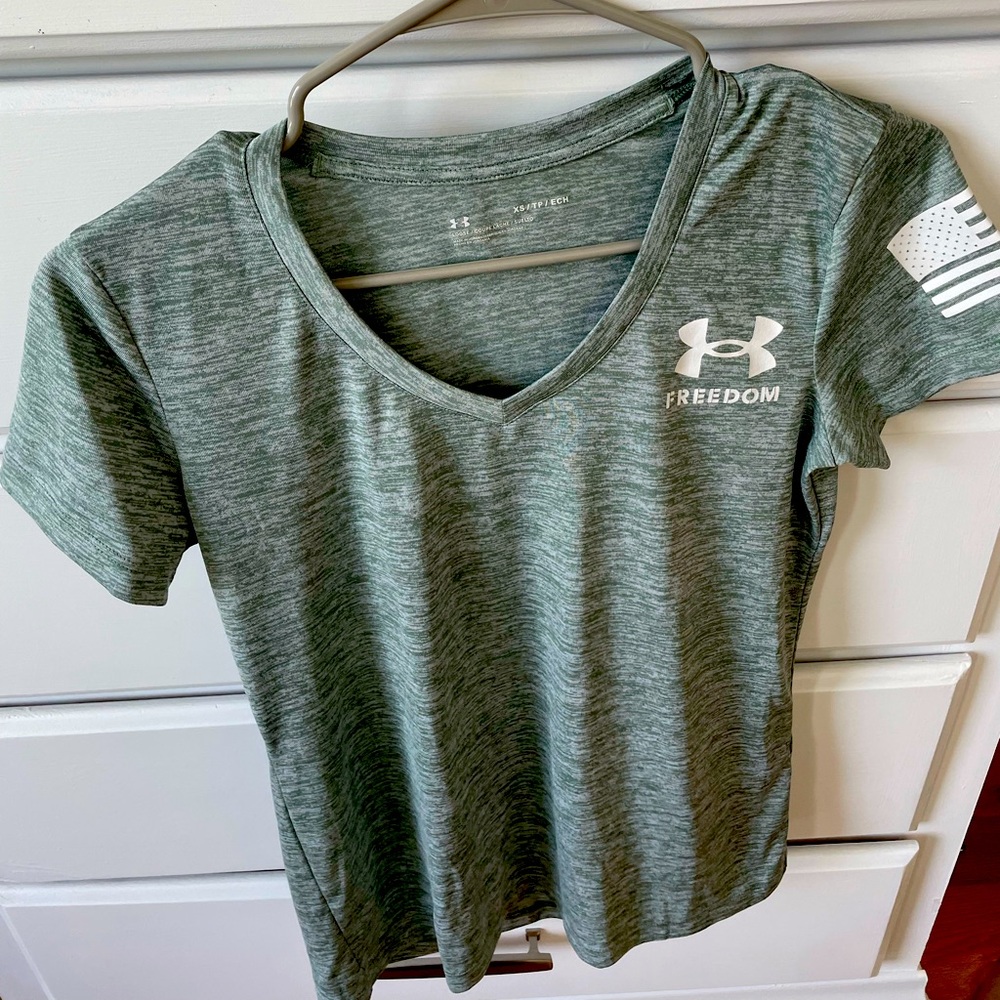 Light green under armour shirt.